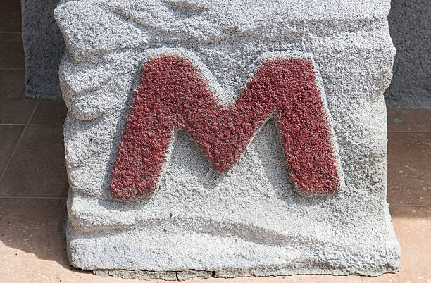 istock M toilet sign on stone 517499177
