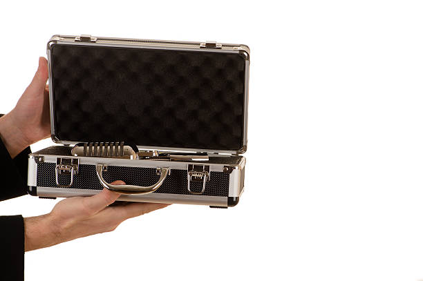 istock hands hold an open metal case with a microphone 517502196