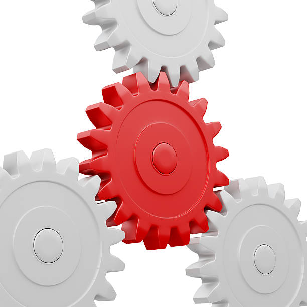 istock Gear cogwheels working together on white 517503101