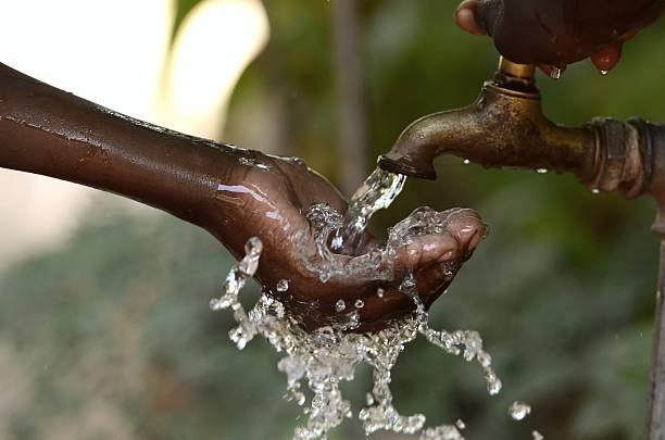 Climate Change Symbol: Handful Of Water Scarsity for Africa Symbol stock photo