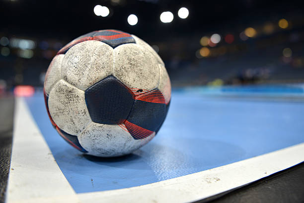 handball Closeup of a handball in the corner of a handball playing court inside a handball arena handball stock pictures, royalty-free photos & images