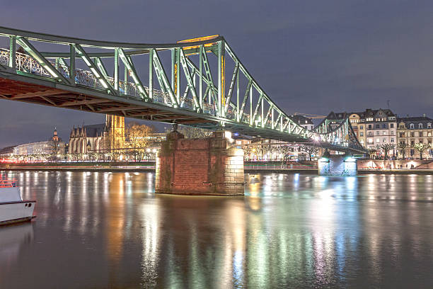 istock Old iron bridge in Frankfurt Main, Germany 517512722