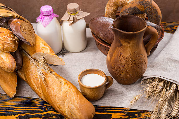 istock Cup of milk with grains and bread 517514736