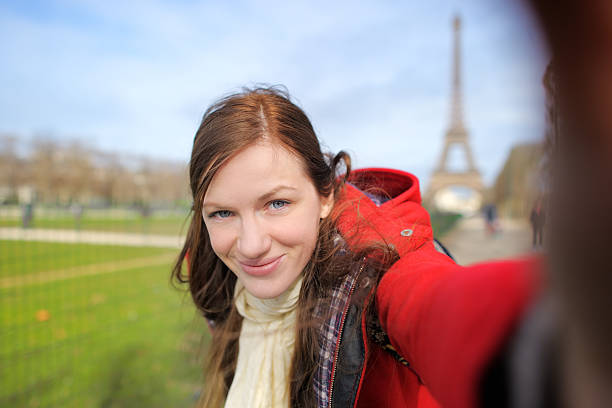 istock Woman taking selfie near the Eiffel tower 517515648