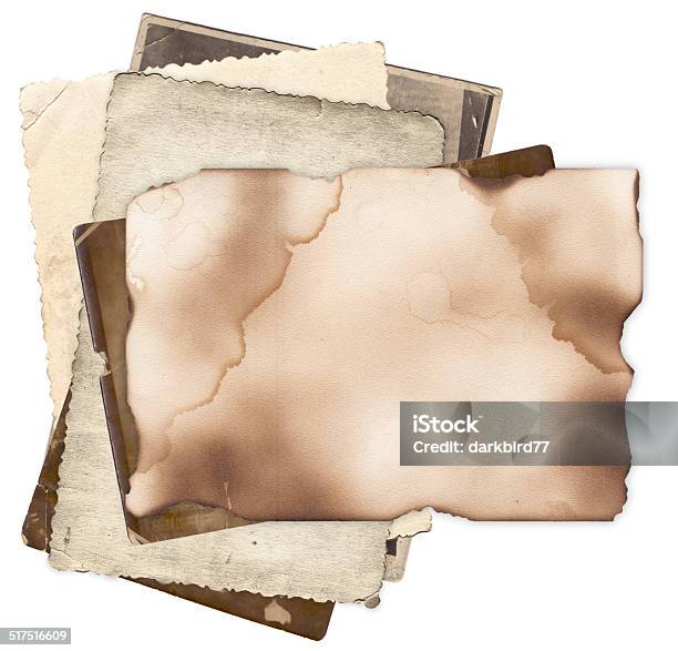 Old Paper With Burned Edges On Bunch Of Vintage Photos Stock Photo - Download Image Now