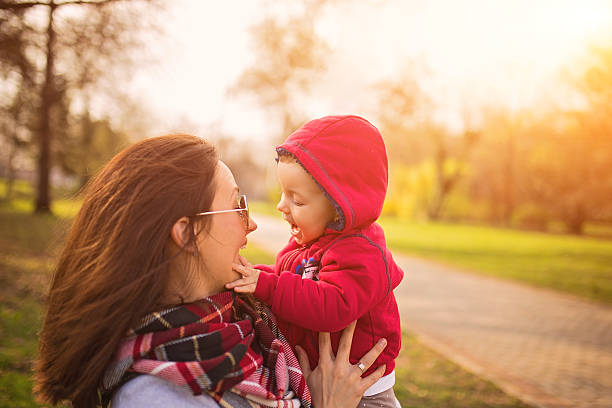 istock Baby playing with mother 517516754