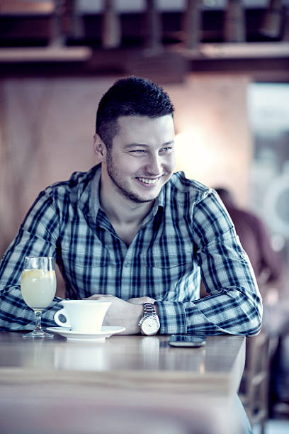 istock Young Handsome Men how Smiling in the Coffee Shop 517517164
