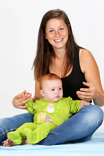 Baby and Babysitter stock photo