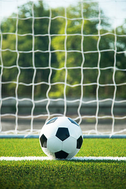istock Soccer ball and goal 517518227