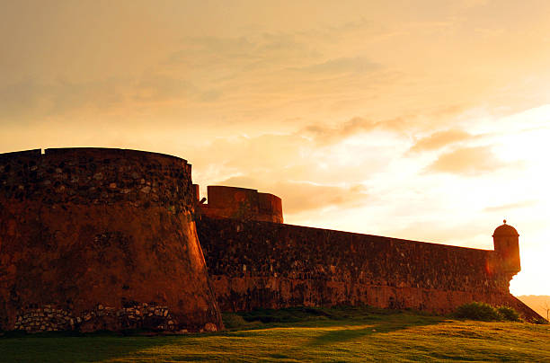 Saint Phillip fort, Puerto Plata, Dominican republic - sunset Puerto Plata, Dominican republic: walls of San Felipe fortress at sunset - located at the Puntilla Del Malecón - Fortaleza de San Felipe de Puerto Plata - photo by M.Torres puerto plata stock pictures, royalty-free photos & images