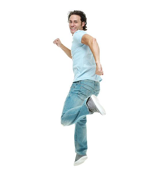 istock Rear view of man running 517518328
