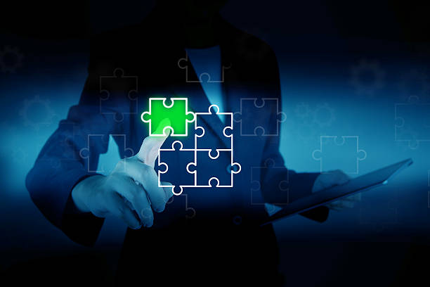 istock Hand pressing a piece of puzzle 517519175