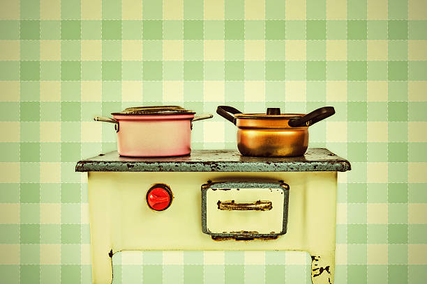 istock Retro styled image of a doll house cooking stove 517519205