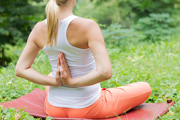 istock Woman doing yoga in nature 517520491