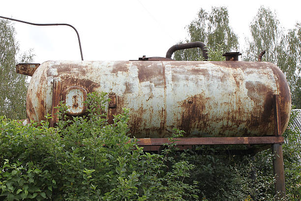 istock Old rusty cistern of a pressure water station at dacha 517522451
