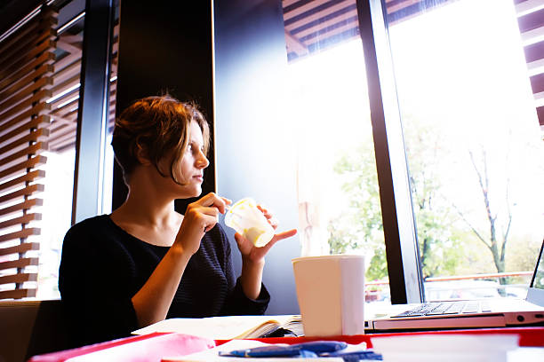 istock woman is having a breakfast in cafe 517523009