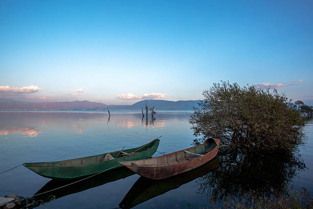 istock iron boat on lake, at sunset 517525394