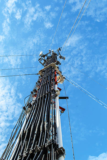 istock High mast metal structure telecommunication on tower with blue sky. 517528667