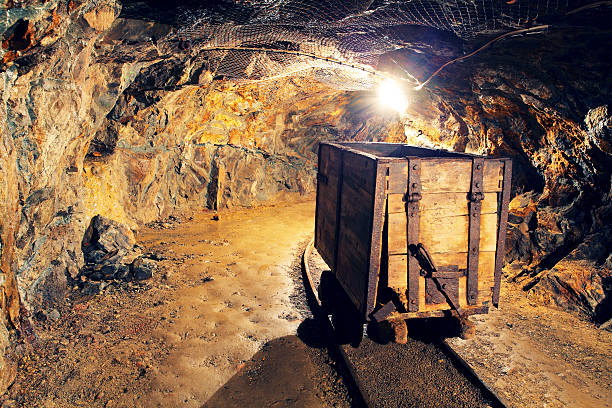 istock Mine gold underground tunnel railroad 517529483