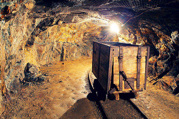 Mine gold underground tunnel railroad Mine gold underground tunnel railroad gold mine photos stock pictures, royalty-free photos & images