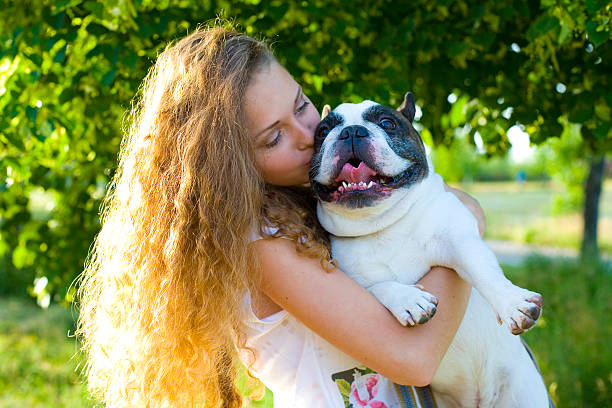istock Girl kissing her dog 517529647