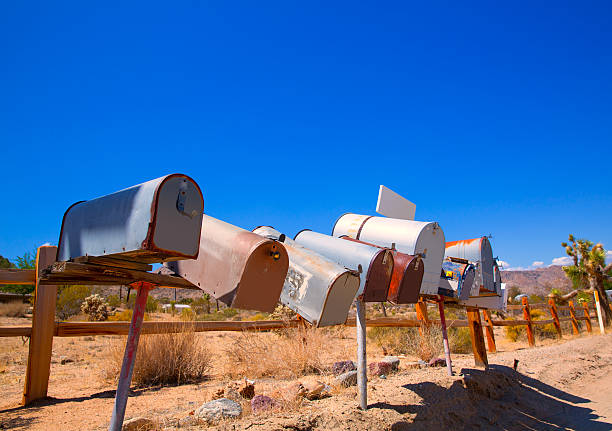 istock Grunge mail boxes in a row at California Mohave desert 517531325