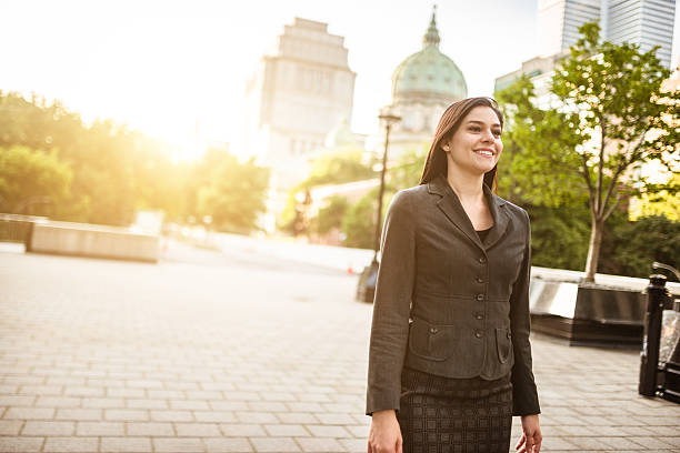 istock successful business woman standing on the city 517532995