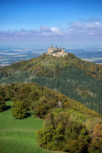 Hohenzollern castle in Baden-Wuerttemberg, Germany in the beginning of autumn, taken from the viewpoint Zeller Horn.