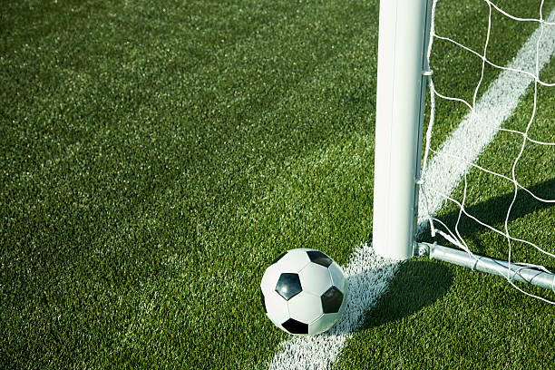 istock Soccer ball and goal 517534489