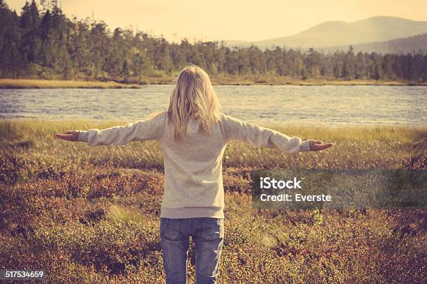 Young Woman Relaxing Outdoor Hand Raised Lifestyle Vacations Concept Stock Photo - Download Image Now