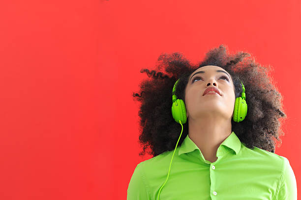 istock Young woman with green headset 517535454