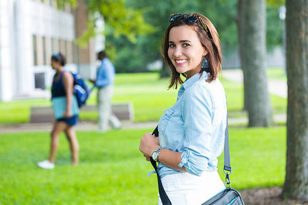 istock Cute college student walking on beautiful campus 517535591