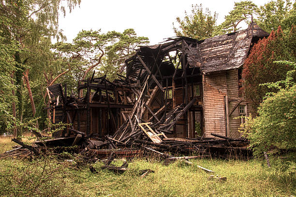 istock Burnt old wooden house 517536093