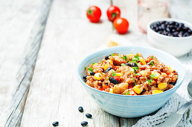 istock Black beans, corn and tomato red and white rice with chicken 517537850