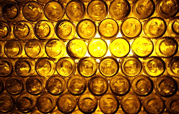 istock blur yellow light from bottom of bottles 517538030