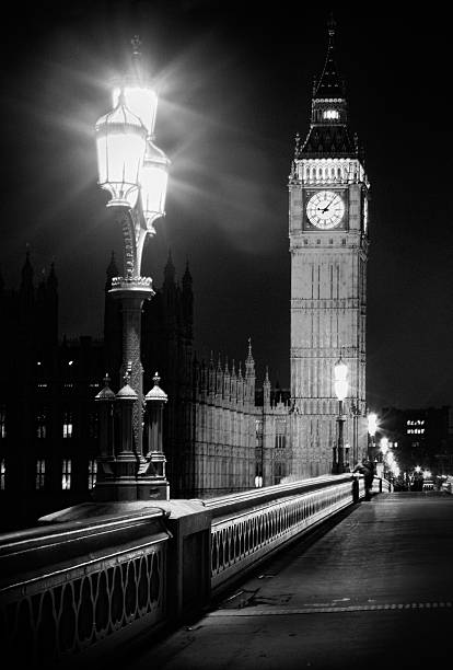 istock Big Ben at night taken from bridge with street light 517538126