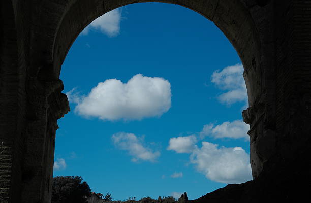 frame of roman arch with cloud and blue sky