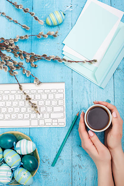 istock The top view of easter on wooden table office workplace 517538200