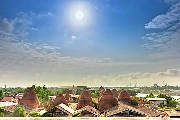 Early sun on the roof of the brick kilns in the countryside with the sun radiating star shines down brickyard panoramic beautiful villages and idyllic in Vietnam