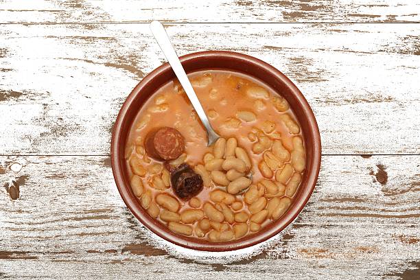 istock Asturian bean stew in a clay pot. 517542176