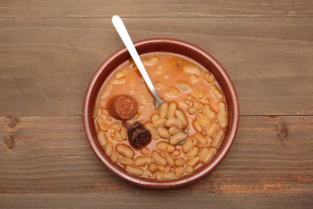 istock Asturian bean stew in a clay pot. 517542202
