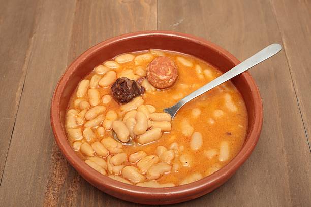 istock Asturian bean stew in a clay pot. 517542250