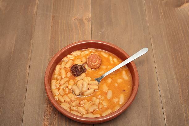 istock Asturian bean stew in a clay pot. 517542274