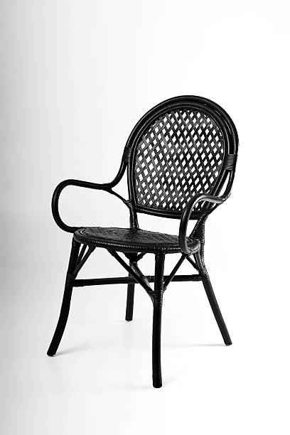 istock Black wicker chair on a gray background 517542530