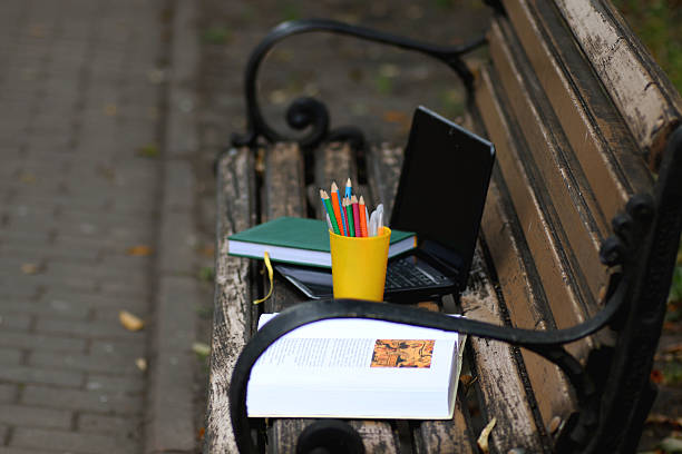 istock books on a bench in the school year 517542708