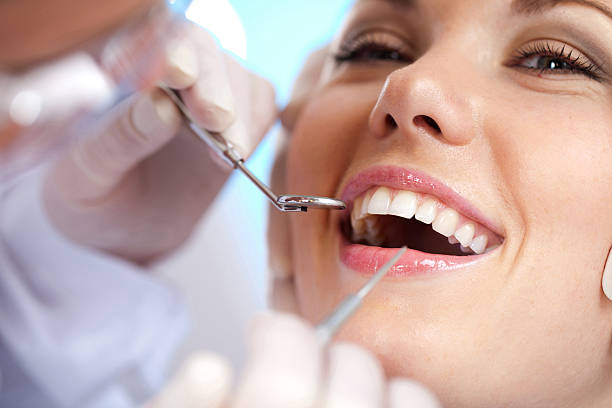 dental clinic examination and treatment of the teeth in the dental clinic human teeth photos stock pictures, royalty-free photos & images