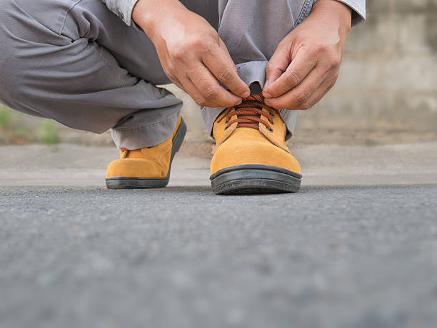 istock Siting to wears safety shoes 517543942