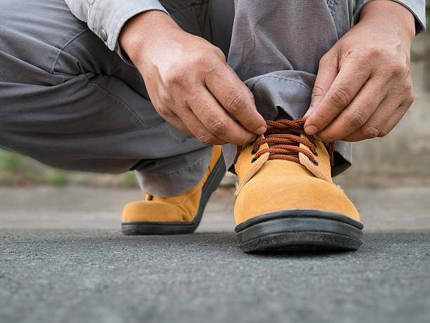 istock Siting to wears safety shoes 517544060