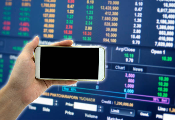 istock Female Hand holding smart phone over blured background 517544438