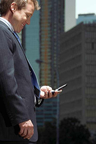 istock Businessman with a cell phone 517544454